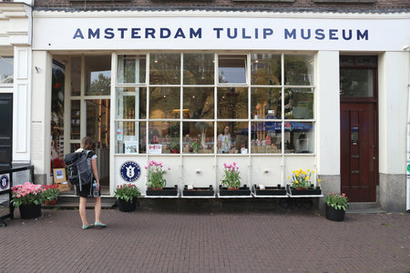 AMSTERDAM, NETHERLANDS - JULY 7, 2017: People visit Amsterdam Tulip Museum in the Netherlands. Amsterdam is the capital city of The Netherlands.のeditorial素材