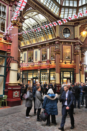 LONDON, UK - APRIL 22, 2016: People celebrate Saint George's Day in Leadenhall Market, London. Saint George is the patron saint of England.のeditorial素材