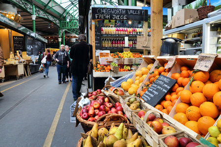 LONDON, UK - APRIL 22, 2016: People shop at Borough Market in Southwark, London. It is one of oldest markets in Europe. Its 1,000th birthday was in 2014.のeditorial素材