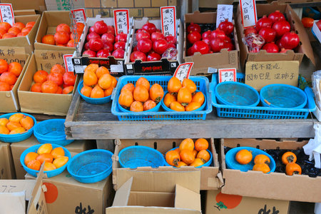 MINOO, JAPAN - NOVEMBER 22, 2016: Persimmon and pomegranate fruit varieties in Minoo, Osaka. Japan autumn includes celebration of persimmon (kaki) fruit harvest.のeditorial素材