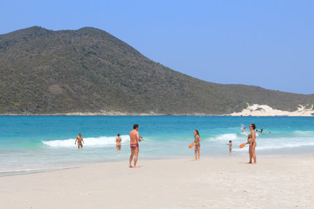 CABO FRIO, BRAZIL - OCTOBER 17, 2014: People visit Cabo Frio Prainhas beach in state of Rio de Janeiro in Brazil. Brazil had 5.17 million visitors in 2012.のeditorial素材