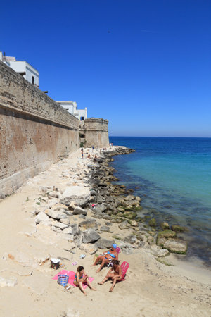 MONOPOLI, ITALY - MAY 29, 2017: People visit Monopoli beach in Apuliaa, Italy. With 50.7 million annual visitors Italy is one of the most visited countries.のeditorial素材