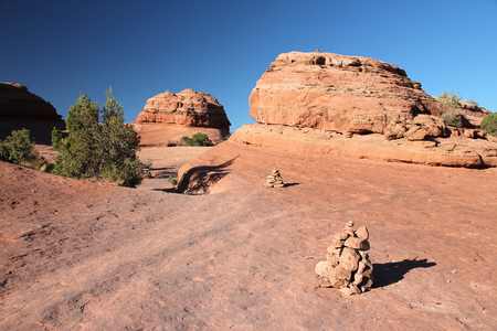 Hiking trail in Utah, United States. Cairns trail marking in Arches National Park.