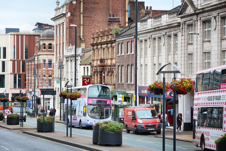 LEEDS, UK - JULY 11, 2016: People shop at Headrow street in downtown Leeds, UK. Leeds urban area has 1.78 million population.のeditorial素材