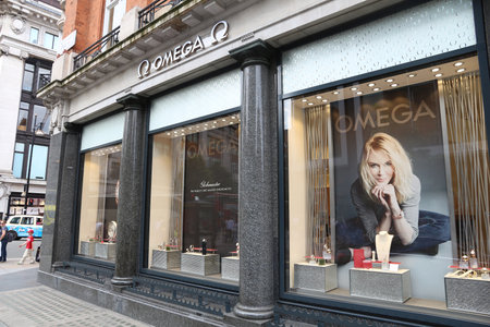 LONDON, UK - JULY 7, 2016: People shop at Omega jewelry store, Oxford Street in London. Oxford Street has approximately half a million daily visitors and 320 stores.のeditorial素材