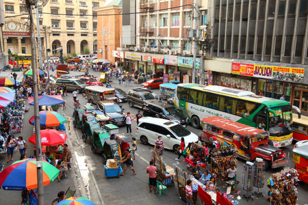 MANILA, PHILIPPINES - NOVEMBER 25, 2017: People drive in heavy traffic in Manila, Philippines. Metro...