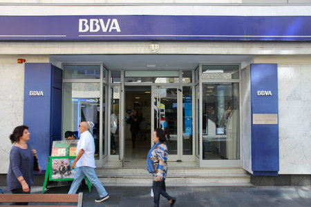 LAS PALMAS, SPAIN - NOVEMBER 30, 2015: People visit BBVA bank branch in Las Palmas, Spain. Banco Bilbao Vizcaya Argentaria (BBVA) is a large Spanish banking group.のeditorial素材