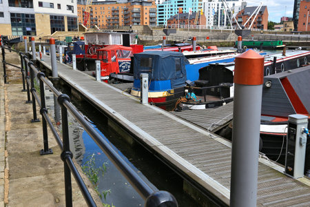 LEEDS, UK - JULY 12, 2016: House boats moored in Leeds, UK. There are 15,000 people living in house...