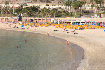 GRAN CANARIA, SPAIN - DECEMBER 4, 2015: People visit Amadores Beach in Gran Canaria, Spain. Canary Islands had record 12.9 million visitors in 2014.のeditorial素材