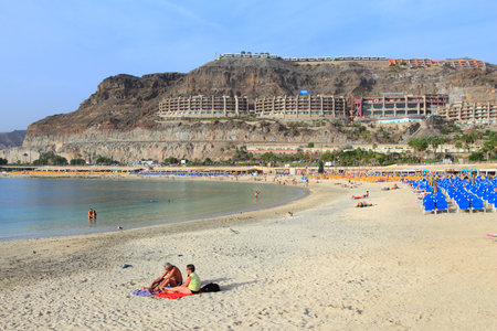 GRAN CANARIA, SPAIN - DECEMBER 4, 2015: People visit Amadores Beach in Gran Canaria, Spain. Canary Islands had record 12.9 million visitors in 2014.のeditorial素材