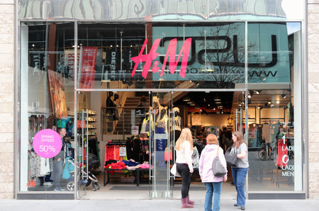 LIVERPOOL, UK - APRIL 20, 2013: Shoppers visit H&M fashion store in Liverpool, UK. H&M has 4,500 casual fashion stores in more than 60 countries.のeditorial素材