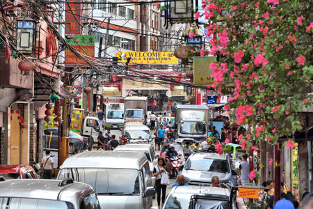 MANILA, PHILIPPINES - NOVEMBER 25, 2017: People visit Chinatown in Manila, Philippines. Metro Manila is one of the biggest urban areas in the world with 24 million people.のeditorial素材