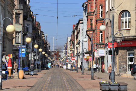 CHORZOW, POLAND - APRIL 7, 2018: People visit Wolnosci street in Chorzow, Poland. Chorzow is a medium city in Silesia region. 111,536 people live here.のeditorial素材