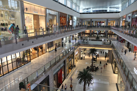 DUBAI, UAE - NOVEMBER 22, 2017: Shoppers visit Dubai Mall. It is the largest mall in the world by total area with 502,000 square metres retail area.のeditorial素材