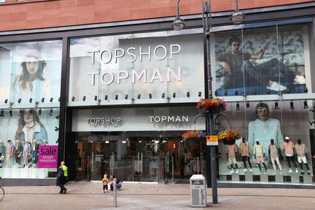 LEEDS, UK - JULY 12, 2016: People walk by Topshop Topman fashion store in Leeds, UK. Topshop is a British fashion retailer owned by Arcadia Group.のeditorial素材