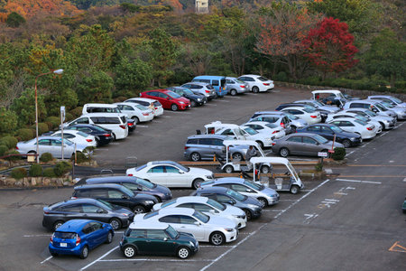 KAMAKURA, JAPAN - DECEMBER 3, 2016: Multiple cars parked in Kamakura, Japan. There are approximately 68.9 million cars registered in Japan.のeditorial素材