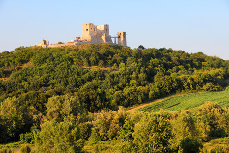 Hungary - Csesznek castle in Central Transdanubia. Medieval hilltop fortress in sunset light.のeditorial素材