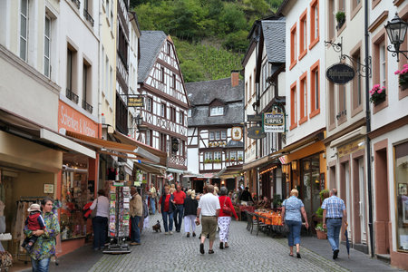 BERNKASTEL-KUES, GERMANY - JULY 19, 2011: Tourists visit Bernkastel-Kues, Germany. According to its...