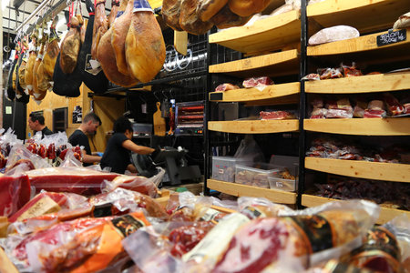 LISBON, PORTUGAL - JUNE 6, 2018: Traditional presunto ham sold at TimeOut Market in Lisbon, Portugal. TimeOut Market is a unique attempt to bring all best restaurants in Lisbon at one place.のeditorial素材