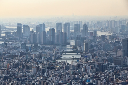 Tokyo city, Japan. Hazy skyline of Chuo ward and Tsukishima island.の写真素材