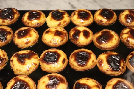 Pasteis de nata - traditional Portugese cuisine egg tarts with creamy filling.