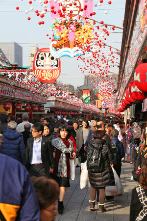 TOKYO, JAPAN - DECEMBER 4, 2016: People visit Nakamise souvenir shop street of Asakusa in Tokyo, Japan. Tokyo is the capital city of Japan. 37.8 million people live in its metro area.のeditorial素材