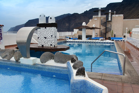 TENERIFE, SPAIN - NOVEMBER 2, 2012: Rooftop swimming pool in Tenerife. Spain is the 3rd most visited country in the world with 75 million annual tourists (2016).のeditorial素材