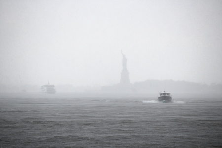 Heavy rain in New York - Statue of Liberty barely visible.の写真素材