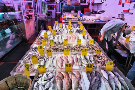 NEW YORK, USA - JULY 1, 2013: Vendors sell fish in Chinatown in New York. NYC Chinatown has an estimated population of 100,000 people and is one of oldest Chinatowns outside Asia.のeditorial素材