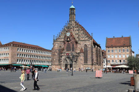 NUREMBERG, GERMANY - MAY 6, 2018: People visit the main square Hauptmarkt in Nuremberg, Germany. Nuremberg is located in Middle Franconia. 511,628 people live here.のeditorial素材