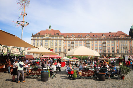 DRESDEN, GERMANY - MAY 10, 2018: People visit Fruhjahrsmarkt (Spring Market) in Dresden. Spring Markets are popular in Germany, selling local food, flowers and produce.のeditorial素材