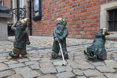 WROCLAW, POLAND - MAY 11, 2018: Handicapped gnomes of dwarves small statues in Wroclaw, Poland. Wroclaw has 350 gnome sculptures around the city.のeditorial素材