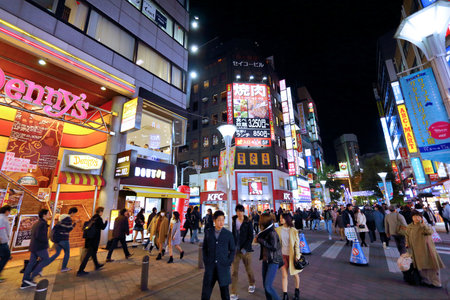 TOKYO, JAPAN - NOVEMBER 29, 2016: People visit night Ikebukuro district of Tokyo, Japan. Tokyo is the capital city of Japan. 37.8 million people live in its metro area.のeditorial素材