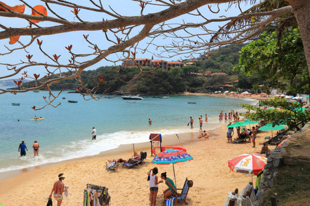 BUZIOS, BRAZIL - OCTOBER 16, 2014: People visit Joao Fernando beach in Buzios, state of Rio de Janeiro in Brazil. Brazil had 5.17 million visitors in 2012.のeditorial素材