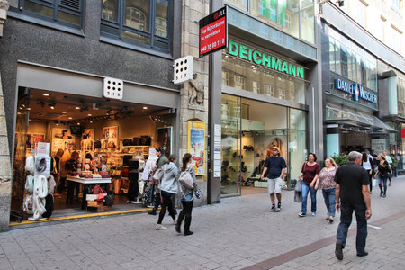 HAMBURG, GERMANY - AUGUST 28, 2014: People visit fashion shops in Spitallerstrasse street, Hamburg. The pedestrianized Spitallerstrasse is one of most popular shopping streets in Germany.のeditorial素材