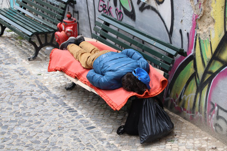 LISBON, PORTUGAL - JUNE 4, 2018: Homeless person sleeping rough in Lisbon, Portugal. There are estimated 3000 homeless persons in Lisbon.のeditorial素材