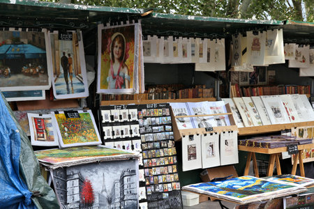 PARIS, FRANCE - JULY 23, 2011: Artworks for sale at a street marketplace in Paris. Paris is the most visited city in the world with 15.6 million international arrivals in 2011.のeditorial素材