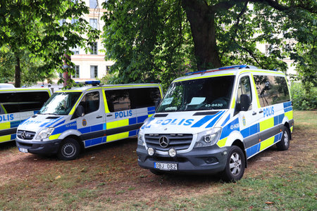 STOCKHOLM, SWEDEN - AUGUST 24, 2018: Swedish Police cars parked in Stockholm. Swedish Police (Polisen) employs more than 28,000 people.のeditorial素材