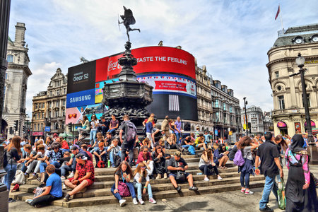 LONDON, UK - JULY 7, 2016: People visit Piccadilly Circus in London. London is the most populous city in the UK with 13 million people living in its metro area.のeditorial素材