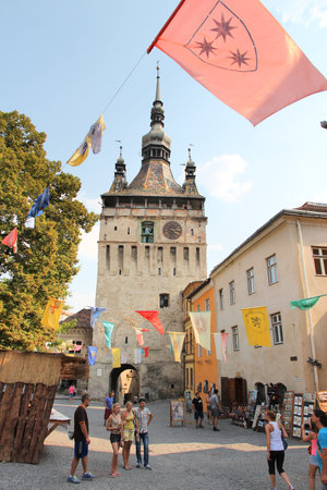 SIGHISOARA, ROMANIA - AUGUST 25, 2012: People visit old town in Sighisoara, Romania. Sighisoara is a UNESCO World Heritage Site and a popular tourism destination.のeditorial素材