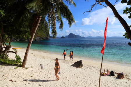 PALAWAN, PHILIPPINES - DECEMBER 1, 2017: People visit Papaya Beach in Palawan, Philippines. 6 million foreign tourists visited Philippines in 2016.のeditorial素材