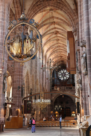NUREMBERG, GERMANY - MAY 8, 2018: People visit St. Lorenz Kirche (Saint Lawrence Church) in Nuremberg. The gothic landmark building belongs to the Evangelical Lutheran Church in Bavaria.のeditorial素材