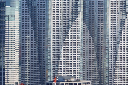 Massive apartment buildings - high density residential architecture of Kachidoki area in Tokyo.