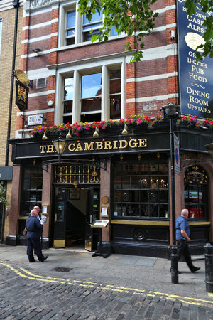 LONDON, UK - JULY 6, 2016: People visit The Cambridge pub in London. It is a typical London pub. There are more than 7,000 pubs in London.のeditorial素材