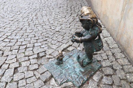 WROCLAW, POLAND - MAY 11, 2018: Gnome or dwarf small statue in Wroclaw, Poland. Wroclaw has 350 gnome sculptures around the city.のeditorial素材