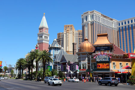 LAS VEGAS, USA - APRIL 14, 2014: People visit the famous Strip in Las Vegas. 15 of 25 largest hotels in the world are located at the strip with more than 60 thousand rooms.のeditorial素材