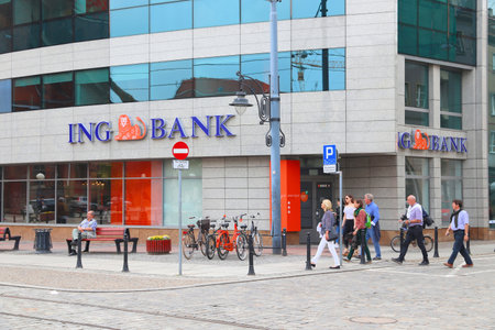 WROCLAW, POLAND - MAY 11, 2018: People walk by ING Bank branch in Wroclaw, Poland. There are 36 banking companies present in Poland (2018).のeditorial素材