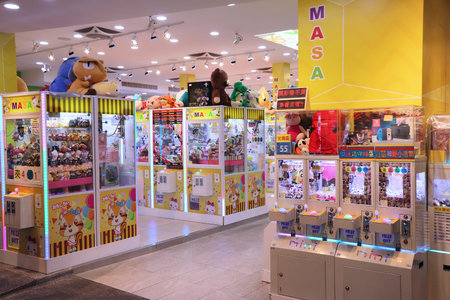 TAIPEI, TAIWAN - DECEMBER 3, 2018: Claw machine gaming parlor in Taipei, Taiwan. Claw machine...