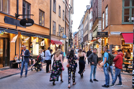 STOCKHOLM, SWEDEN - AUGUST 22, 2018: People shop in Gamla Stan (Old Town) in Stockholm, Sweden....
