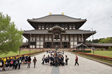 NARA, JAPAN - APRIL 26, 2012: School tour visits Todaiji Temple in Nara, Japan. Nara is a former capital city of Japan. Currently the largest city in Nara Prefecture, it has 362,226 citizens.のeditorial素材